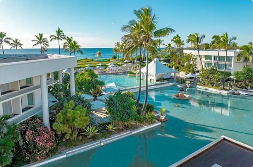 Lagoon pools and palm trees looking out to the beach